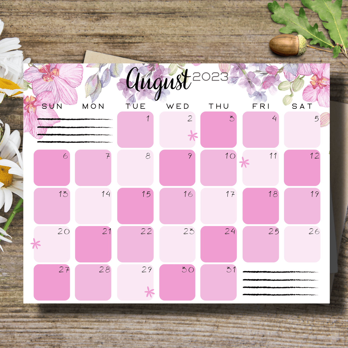 Bright and attractive pink floral August 2023 school calendar, laid out in landscape format on a smooth table surface