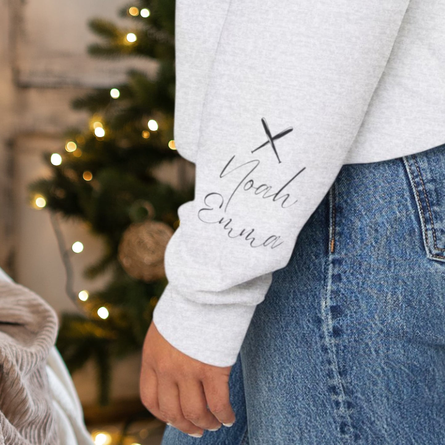 Close-up view of the sleeve design on the Custom Baseball Mom Sweatshirt, highlighting the personalized kids' names and baseball motif.