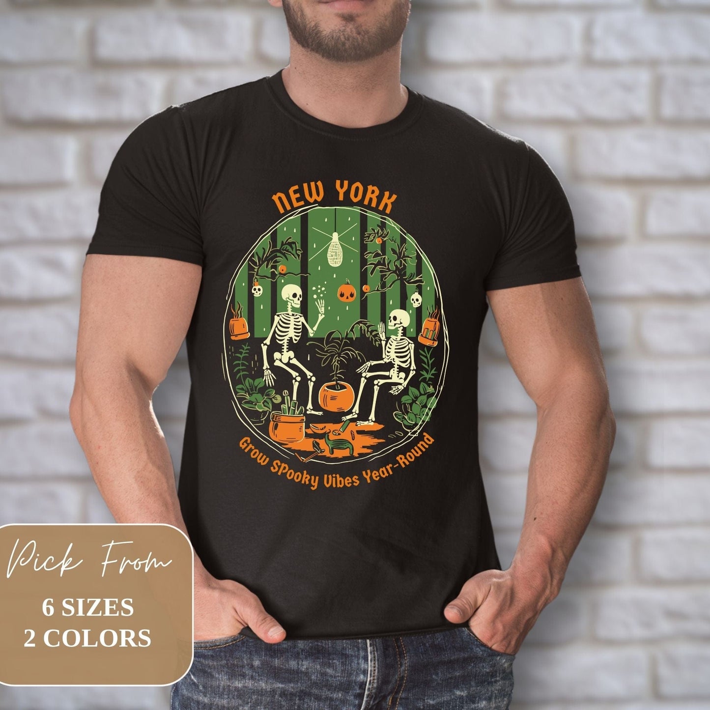 Male model showcasing Trendy New York Halloweentown 2023 Skeleton Printed Youth Halloween Dark Grey Gildan G6400 Shirt