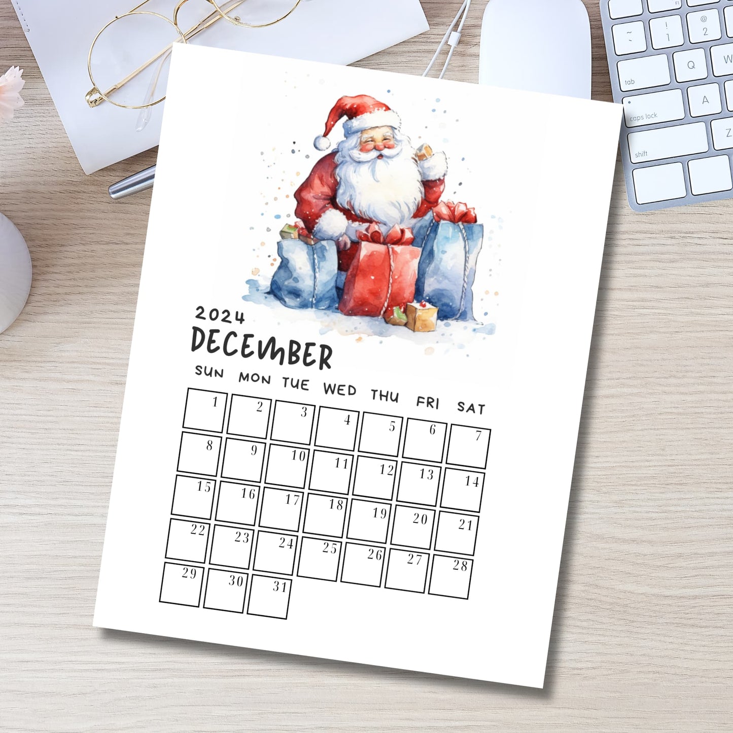 Printable December 2024 A4 calendar mockup in modern desk setting with keyboard and glasses, featuring cheerful Santa illustration and organized date grid for planning