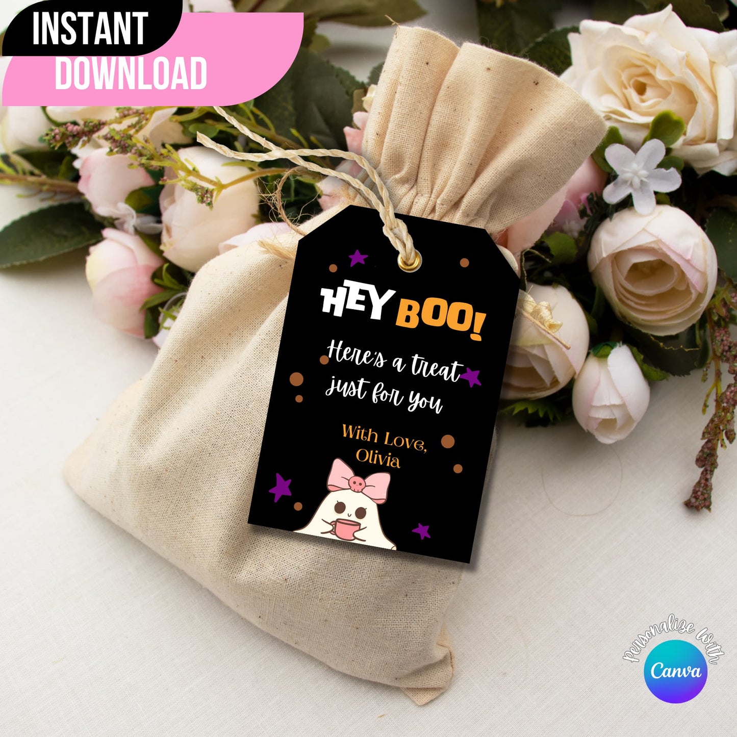 "Hey Boo" Halloween printable tag displayed on a gift bag with flowers on the side.