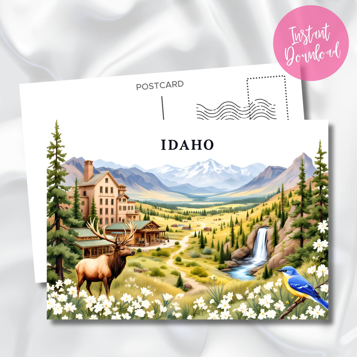 Digital download Idaho postcard highlighting majestic lodge nestled in mountain valley with resident elk, cascading waterfall, evergreen forest, and vibrant mountain bluebird