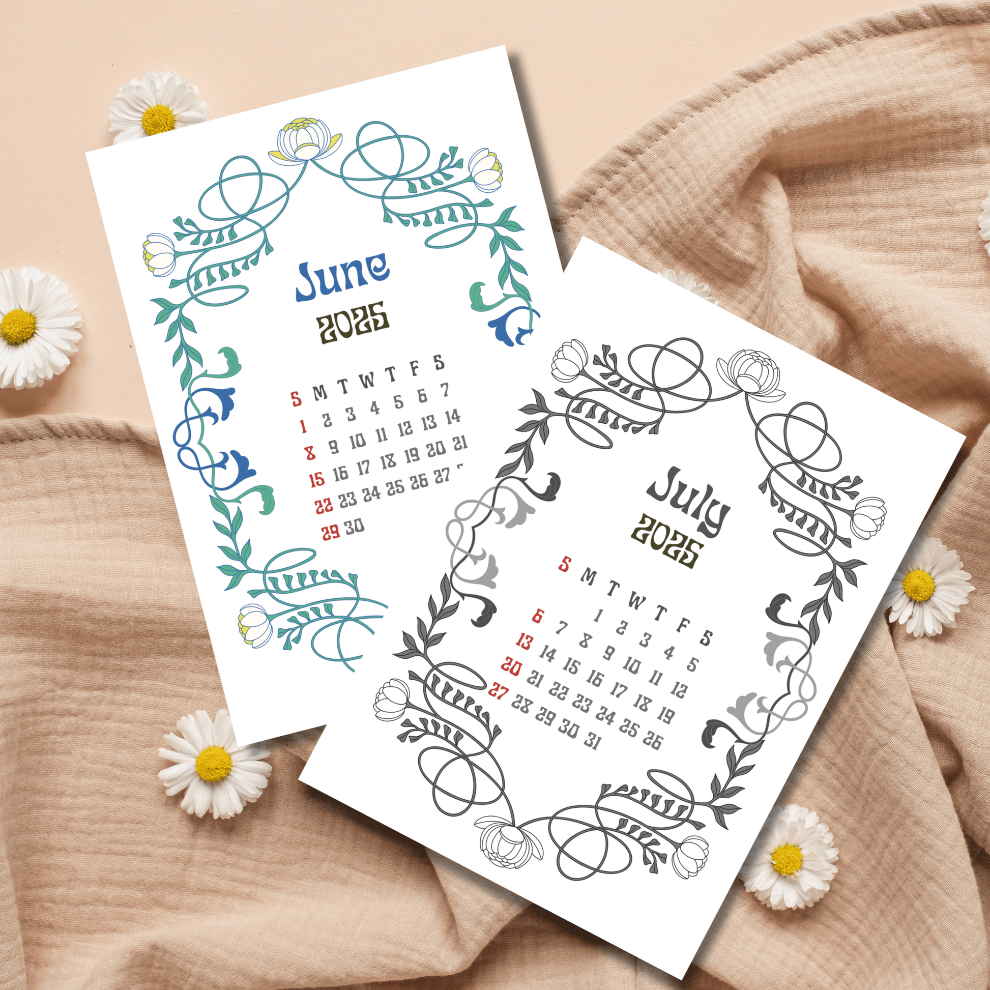 June and July 2025 calendar pages with teal and gray Art Nouveau floral frames, photographed with fresh daisies and natural fabric backdrop