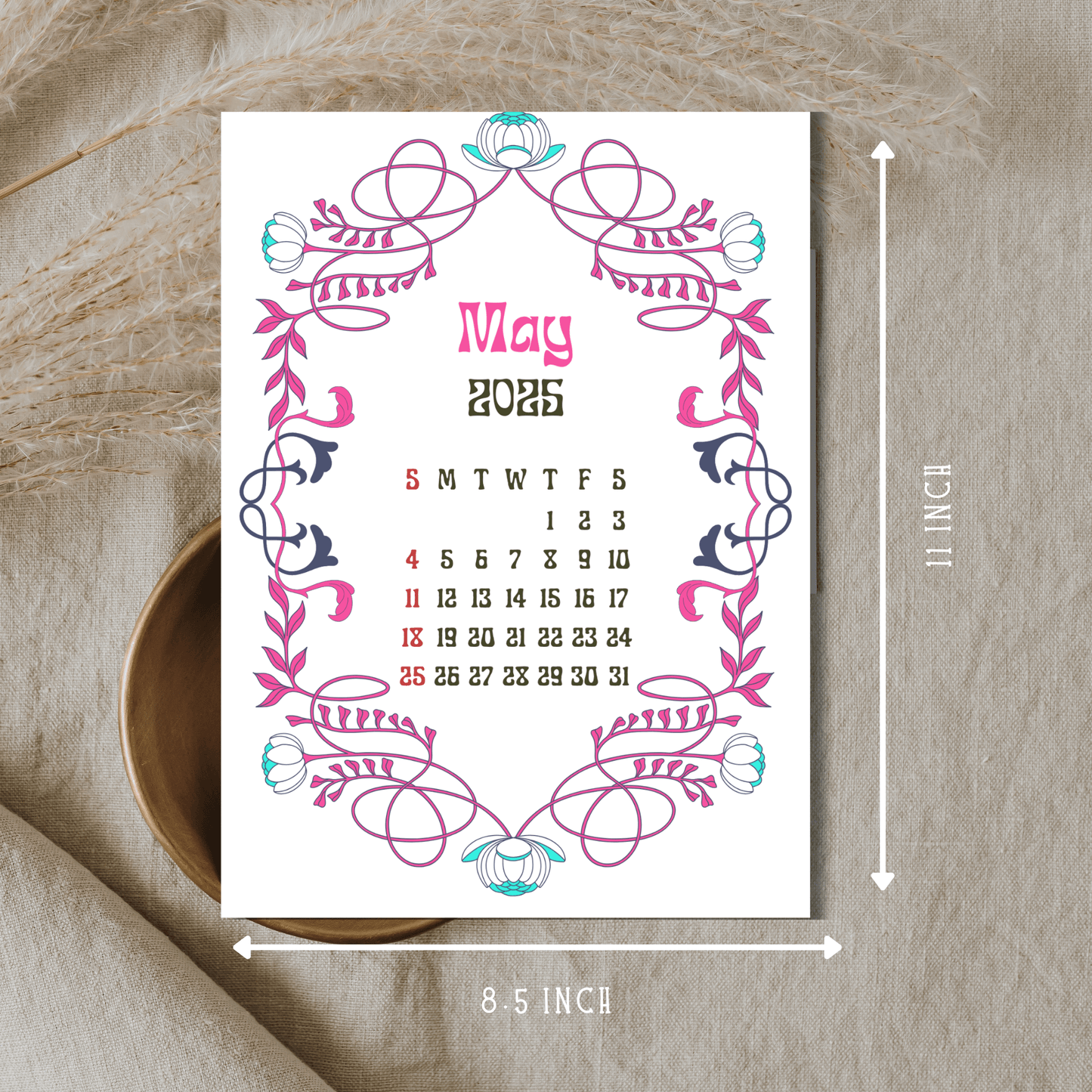 May 2025 calendar with pink and turquoise Art Nouveau border design, showing 8.5 x 11 inch dimensions, displayed on natural linen background