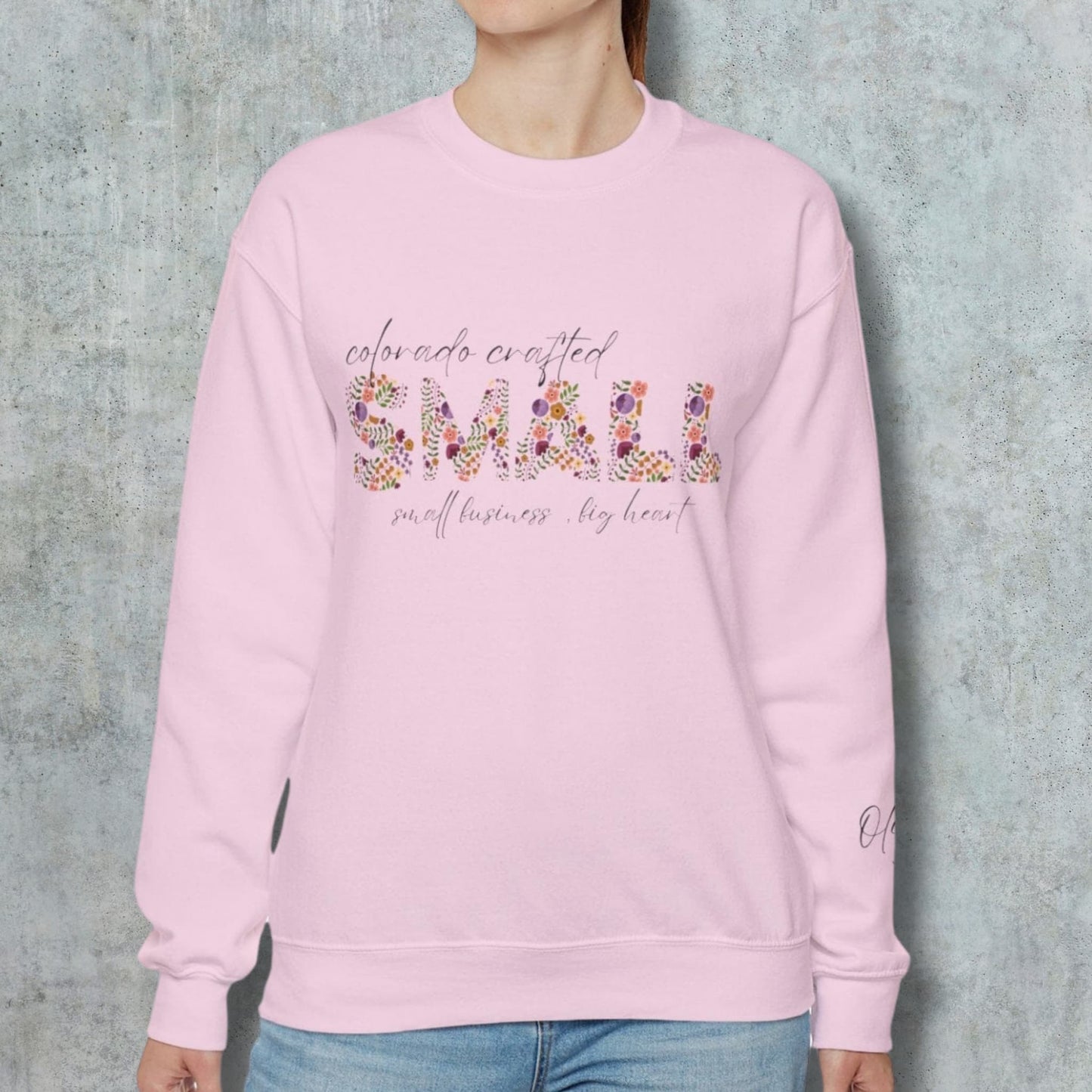 Model Sporting the Custom Name Sleeve on Colorado Small Business Owner Sand Crewneck Sweatshirt.