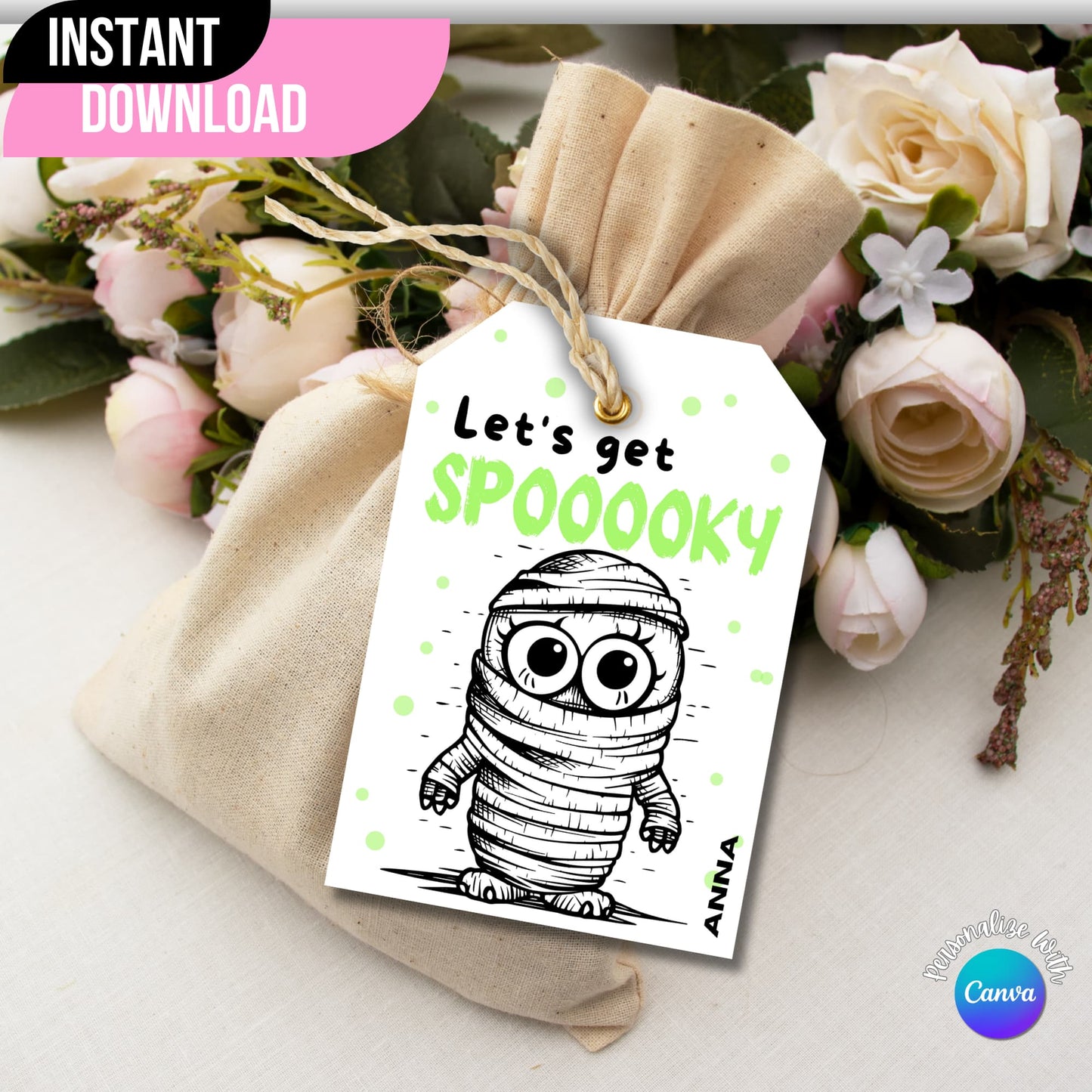 Mummy-themed Halloween printable tag displayed on a gift bag with flowers on the side.