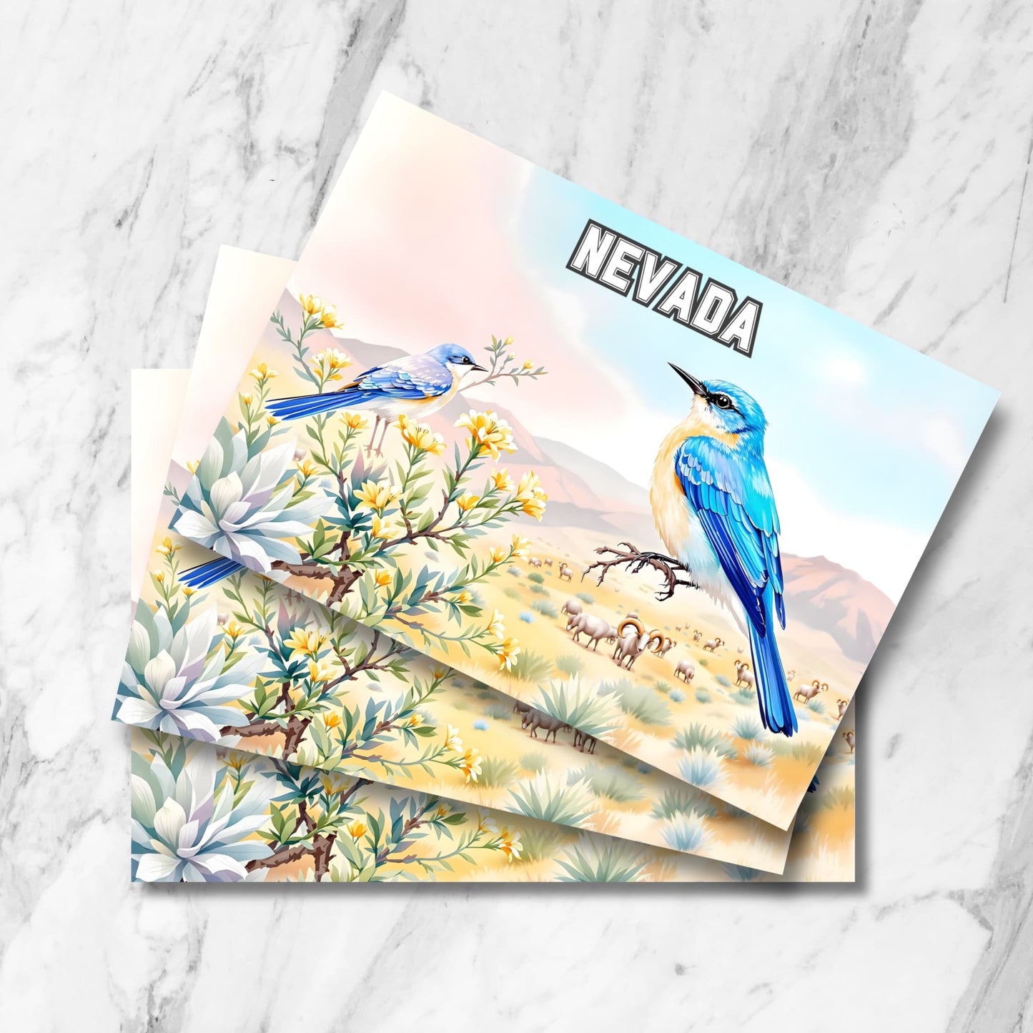 Stack of Nevada state postcards featuring vibrant bluebirds perched on desert blooms with bighorn sheep in the valley below – digital art print.