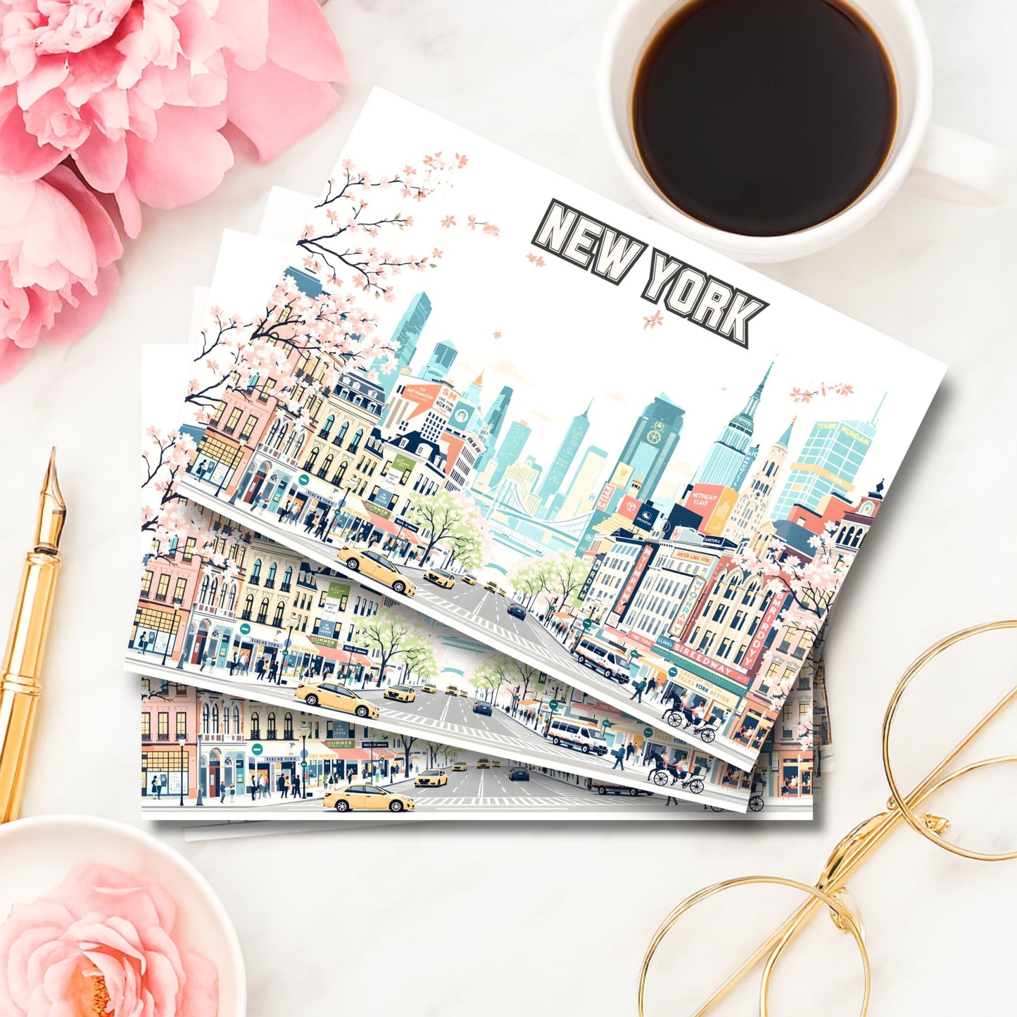 New York City illustrated art print with cherry blossoms and skyline beside coffee cup and pink peonies