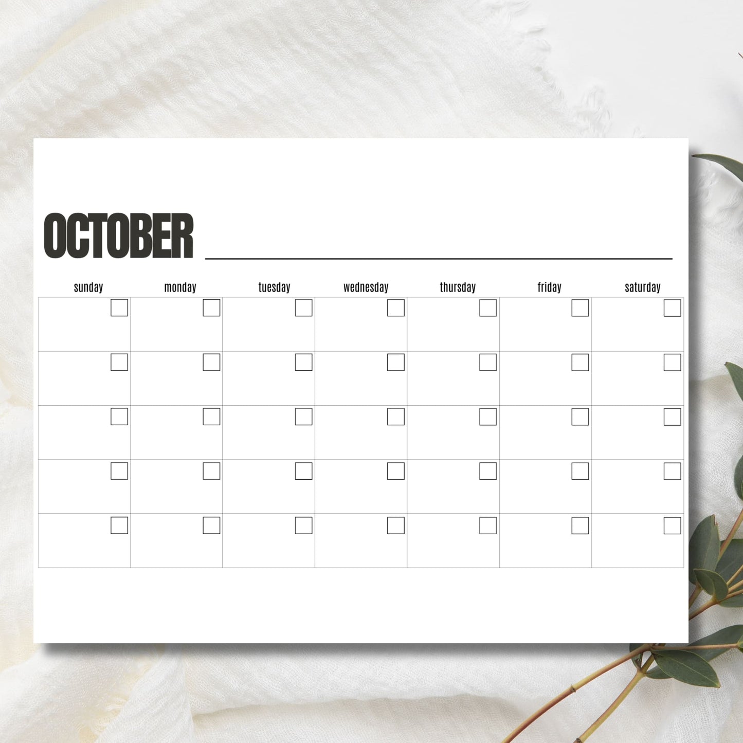Clean October monthly planner on marble background showing horizontal weekly layout