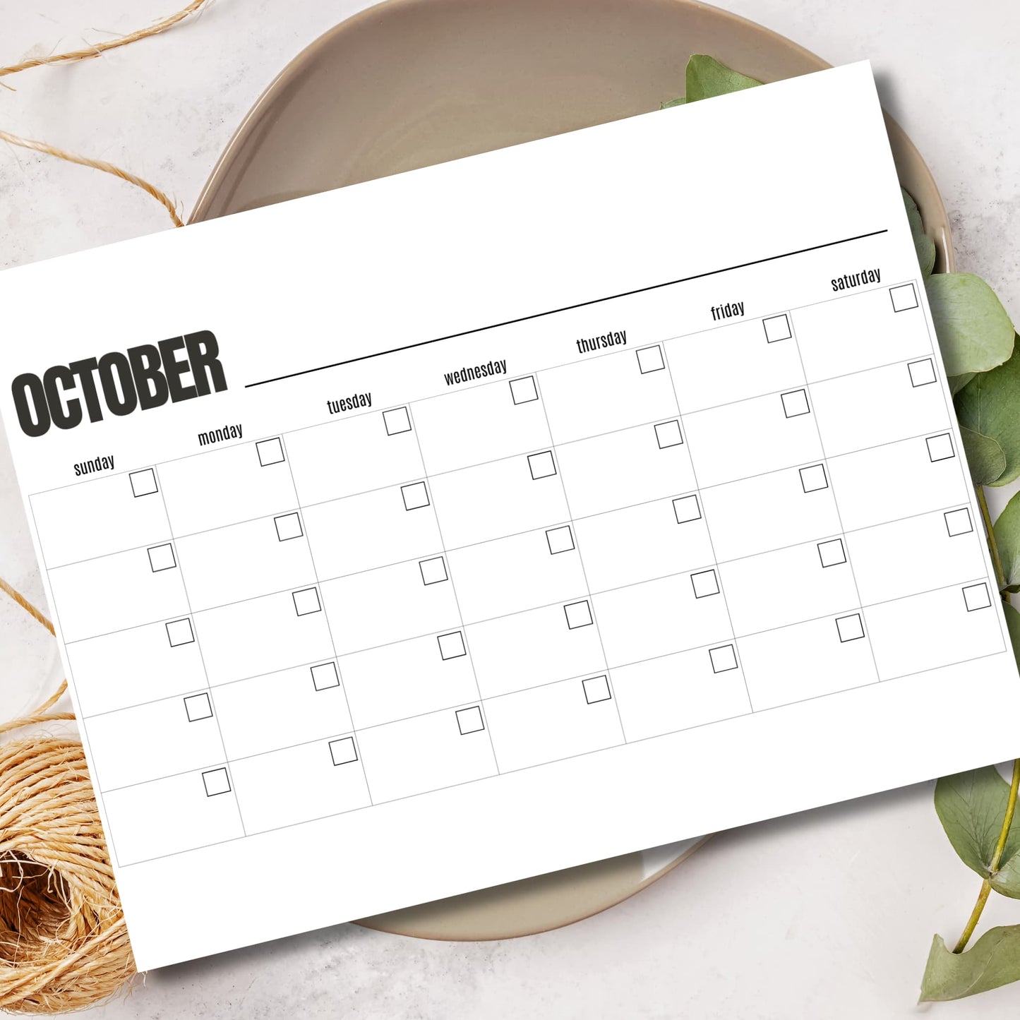 October blank calendar printable in ceramic bowl with eucalyptus leaves and rope details