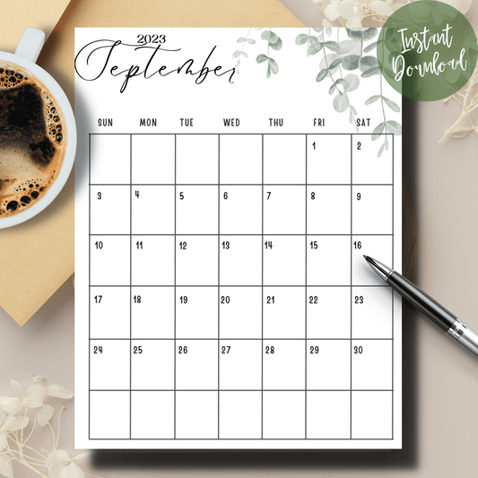 2023 september cute printed calendar on a white table with coffee and pen