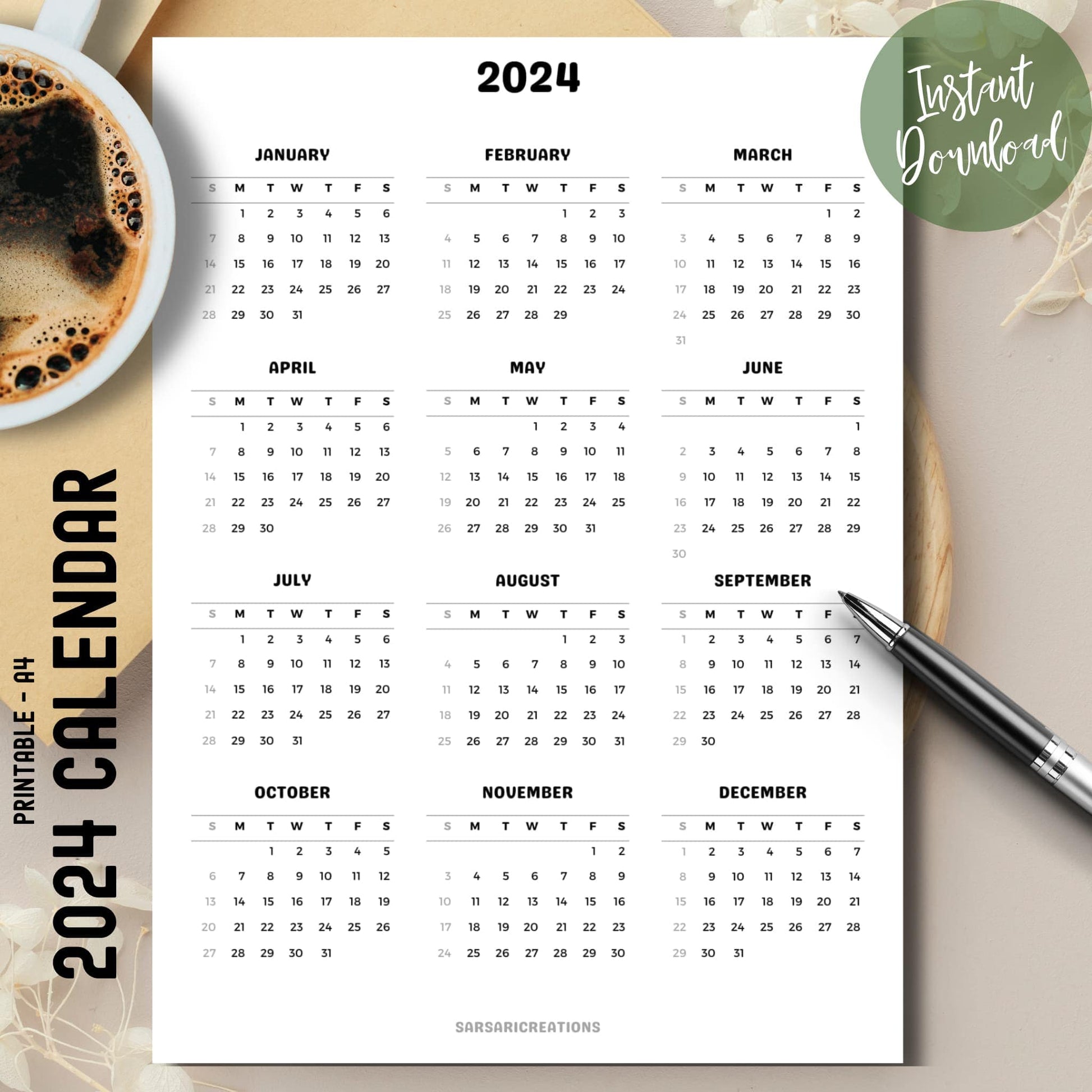  2024 full year calendar printed page on brown desk with coffee cup on left and pen on top, right side.