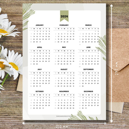 Nature-themed 2024 calendar on brown wooden desk with white flowers and size guide.