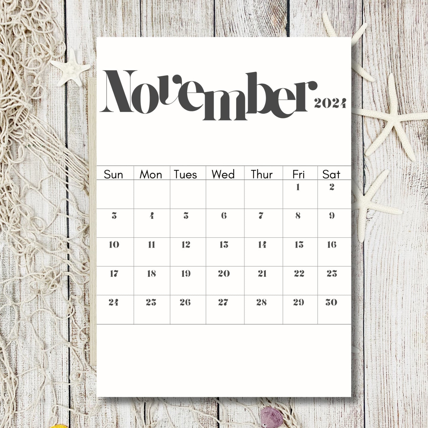 2024 November calendar printable on a wooden grey table with shells