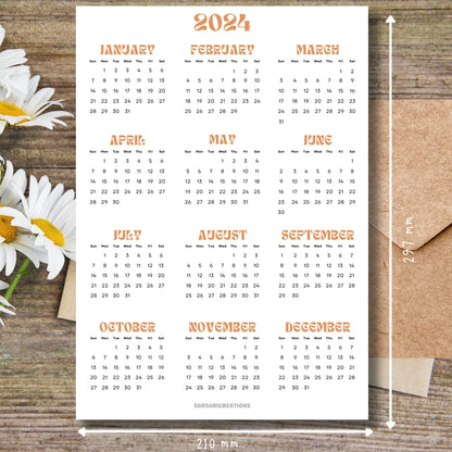 2024 yearly calendar in professional style on brown wooden desk with white flowers and size guide.