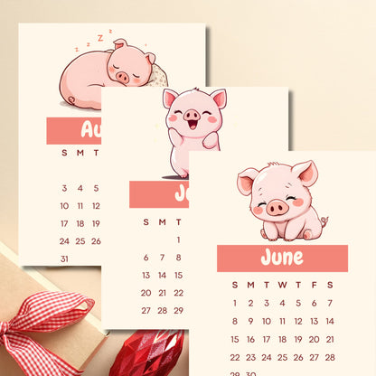 Stack of monthly calendar pages featuring adorable cartoon pigs in different poses, showing June and August months with pink accents and red gingham ribbon decoration