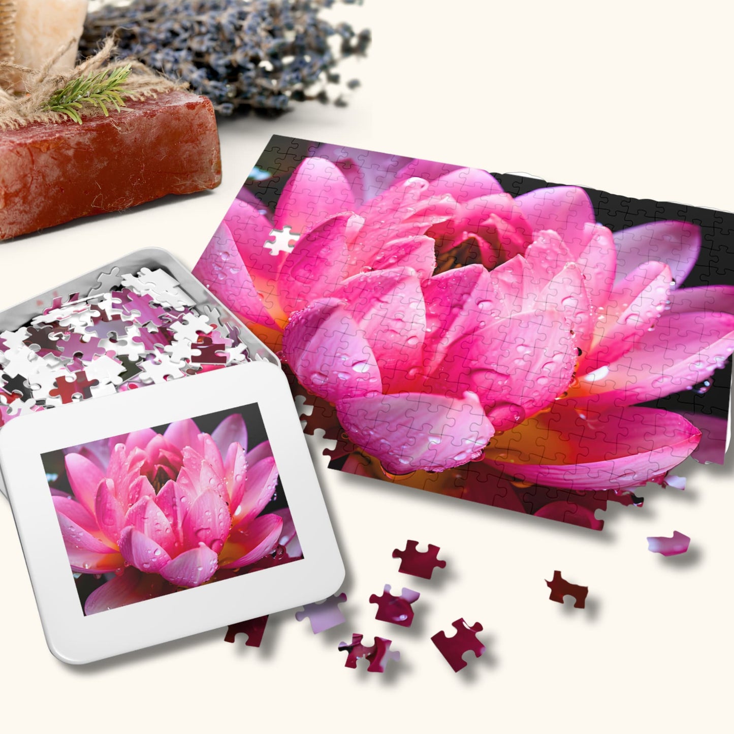 Elegantly packaged 500-piece Nelumbo Nucifera puzzle box alongside its colorful, partially assembled flower puzzle pieces on display.