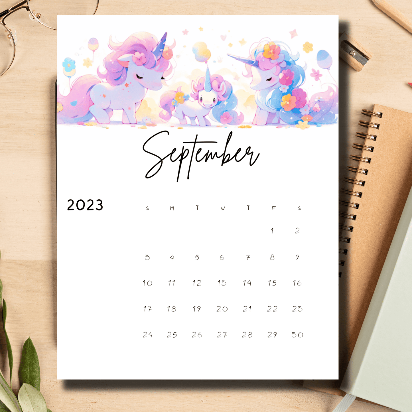 Printable 11 x 8.5-inch calendar with a fun unicorn design set against a September 2023 backdrop, available at Sarsari Creations.