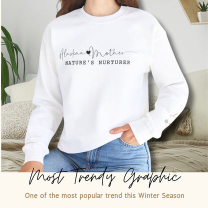 Lifestyle image of a woman wearing the Alaskan Mother Personalized Sweatshirt with stylish graphic text, depicting a trendy and casual look.