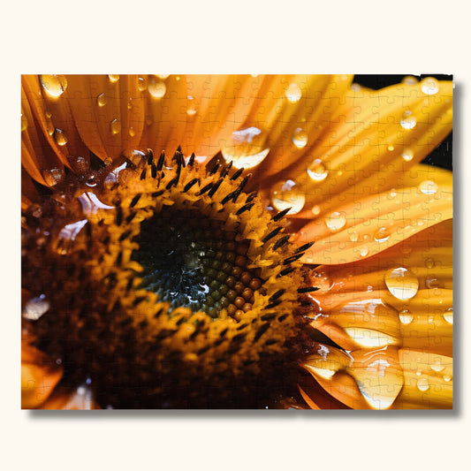 Close-up of 1000-piece Bold and Beautiful Jigsaw Puzzle, highlighting the vibrant yellow sunflower and glistening water drops details.