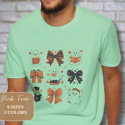 Mint green t-shirt with cute Halloween design featuring ghosts, bows, and books. Available in 6 sizes and 2 colors.