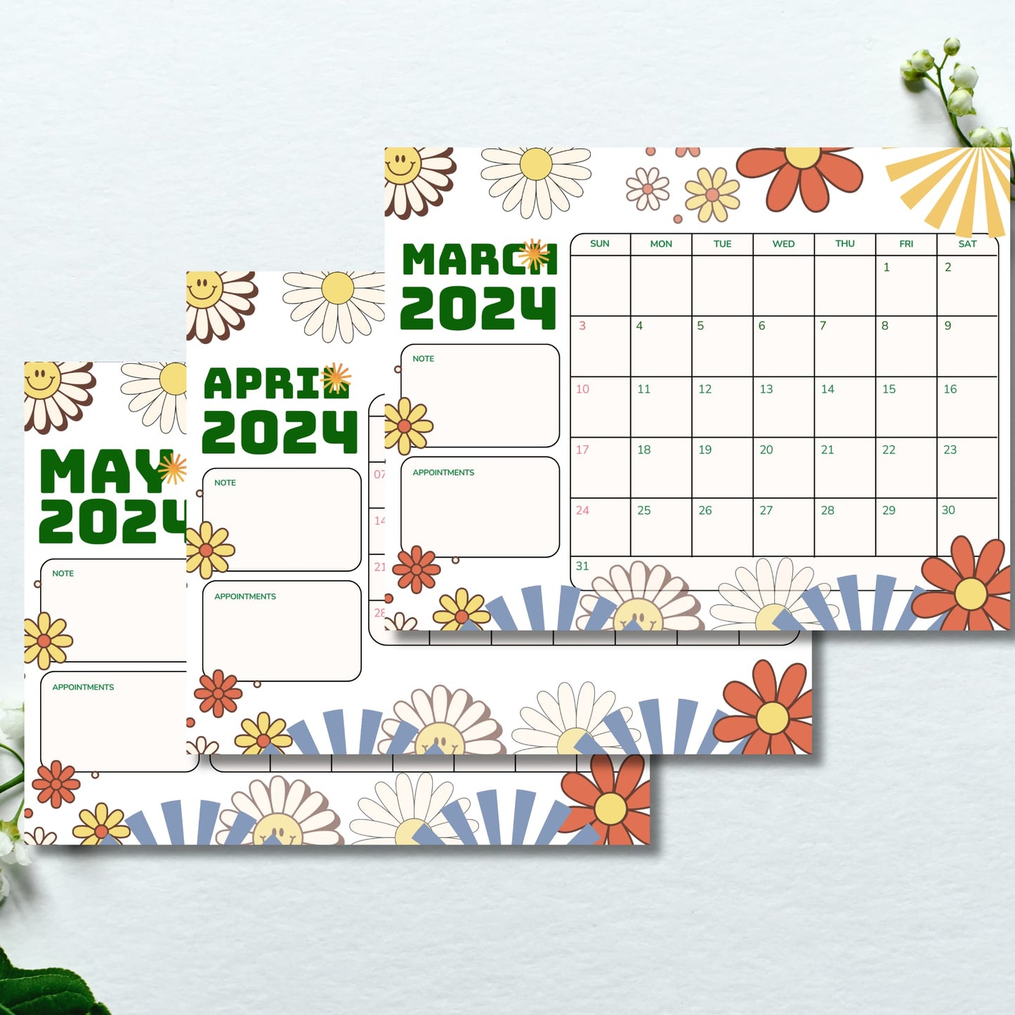 Printed sheets of March to May 2024 calendars with retro backgrounds, set against a serene blue surface for a calm presentation.