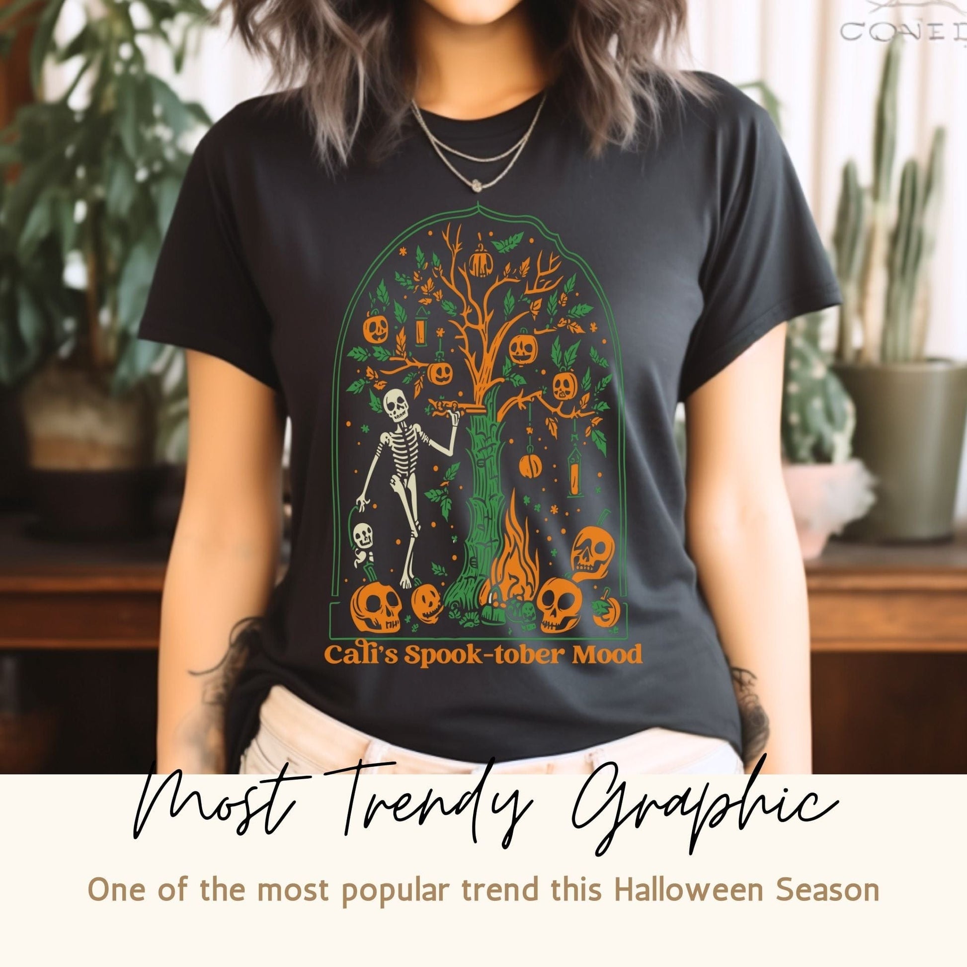 Lifestyle image of Trendy California Halloweentown 2023 Skeleton Printed Gildan G6400 Halloween Tee in a casual setting