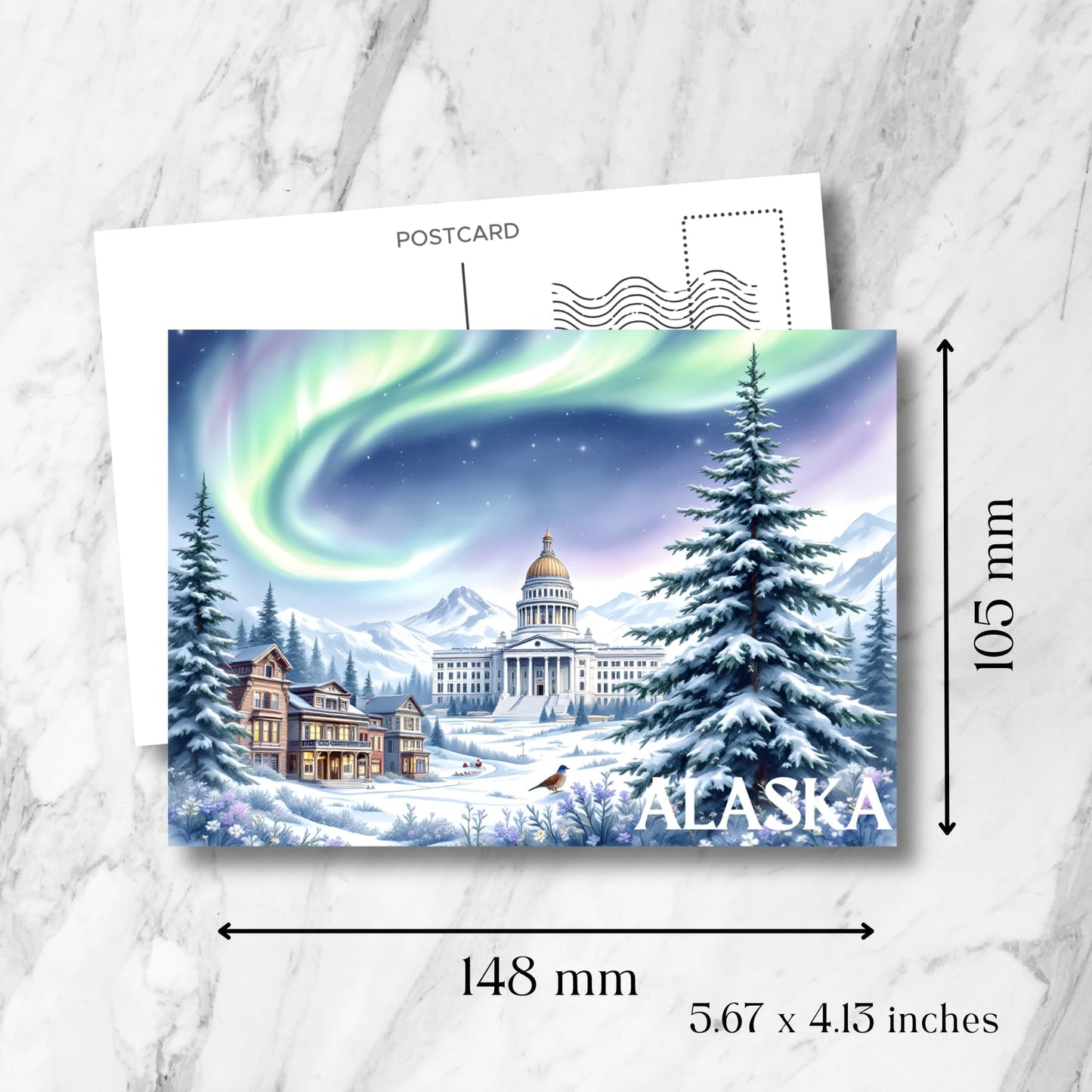 Alaska winter postcard showing exact measurements of 148x105mm (5.67x4.13 inches) featuring aurora borealis over snow-covered landscape with State Capitol and vintage postcard formatting