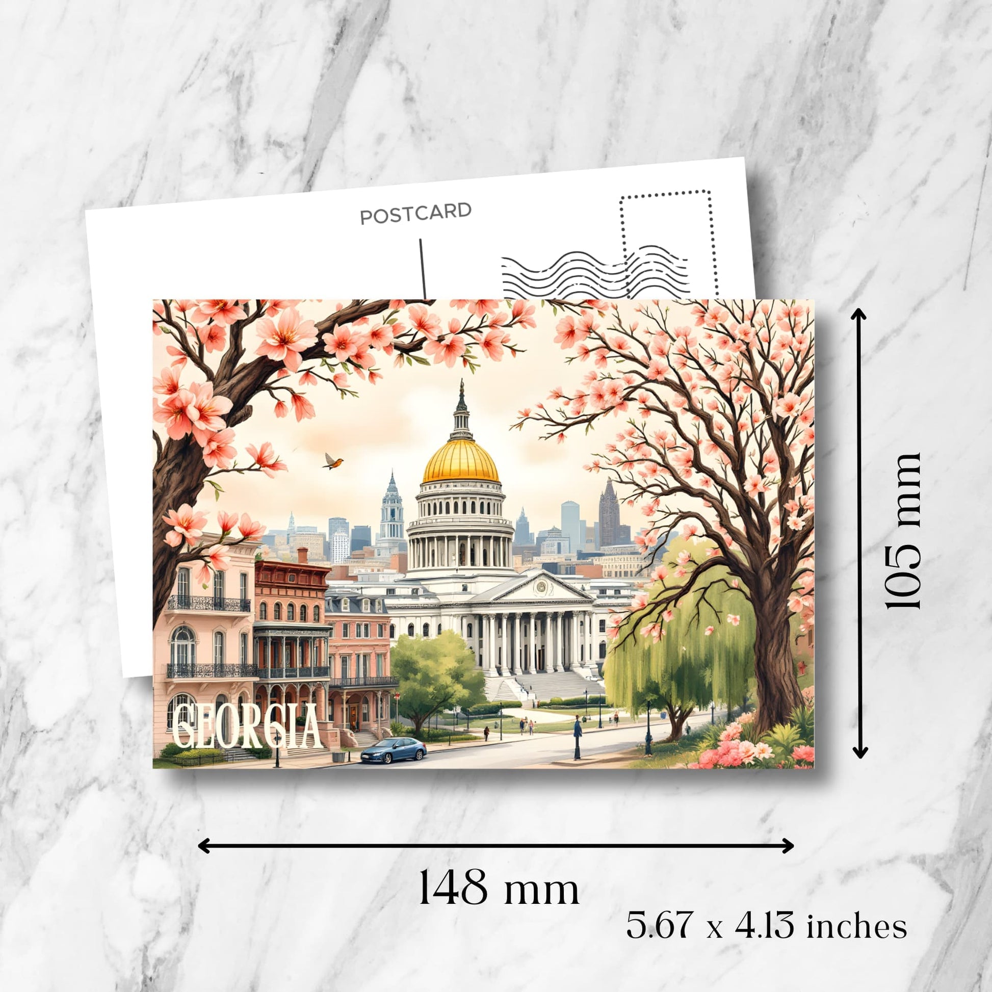 Georgia State Capitol postcard size guide (148x105mm) showcasing neoclassical architecture, pink cherry blossoms, historic brownstones, and downtown Atlanta against soft sunset