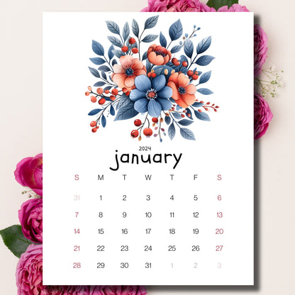 Berries and Blossoms January 2024 calendar on a beige background with pink peonies behind the paper.