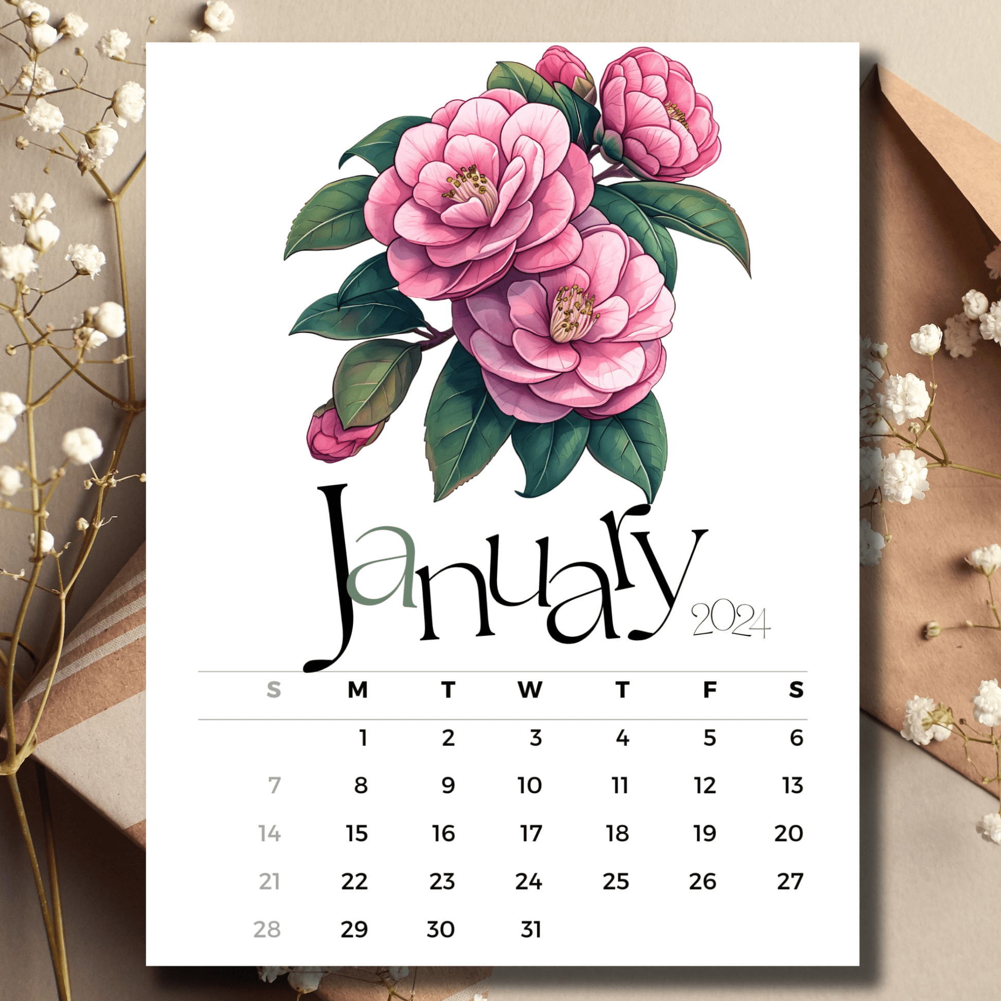 Camellia Elegance January 2024 full year calendar on a table with envelope and small white flowers.