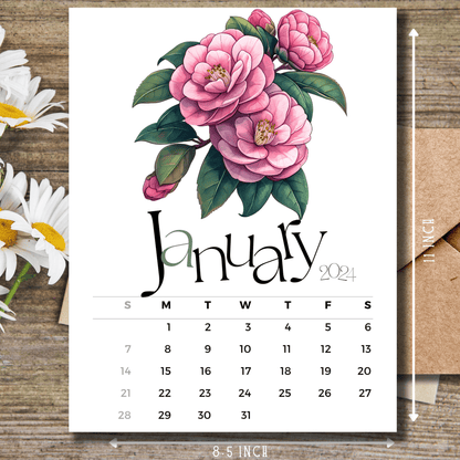 Camellia Elegance January 2024 calendar on wooden desk with white flowers and size guide.