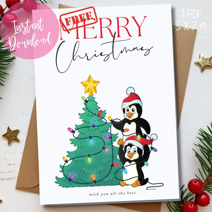 Holiday card with two cartoon penguins in Santa hats stringing lights on Christmas tree, mixed modern calligraphy in red and black, shown with kraft envelope and festive greenery