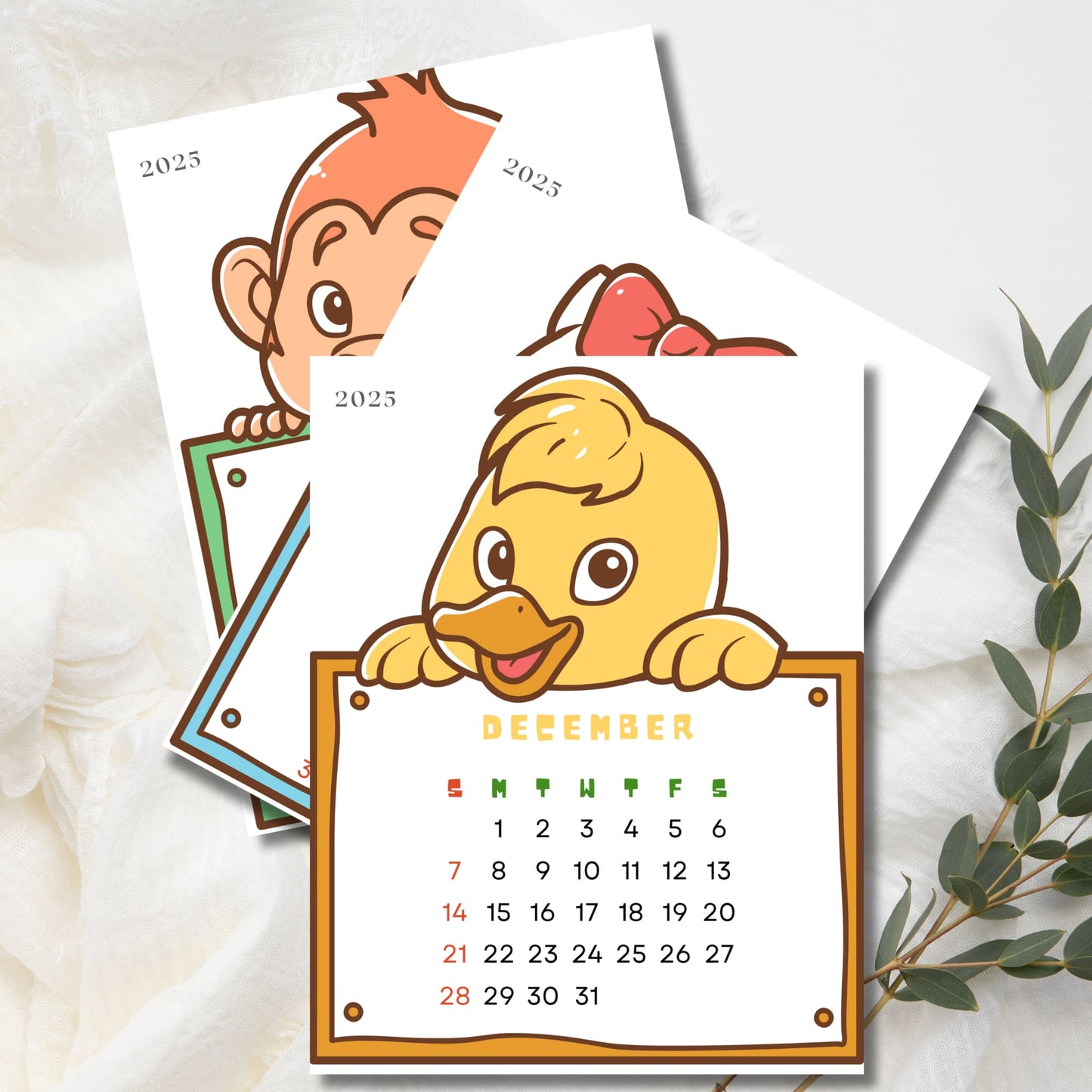 December 2025 animal calendar featuring cartoon duck holding calendar grid with Sunday start. Stacked pages show monkey and rabbit designs. Colorful weekday labels with eucalyptus branch decoration.