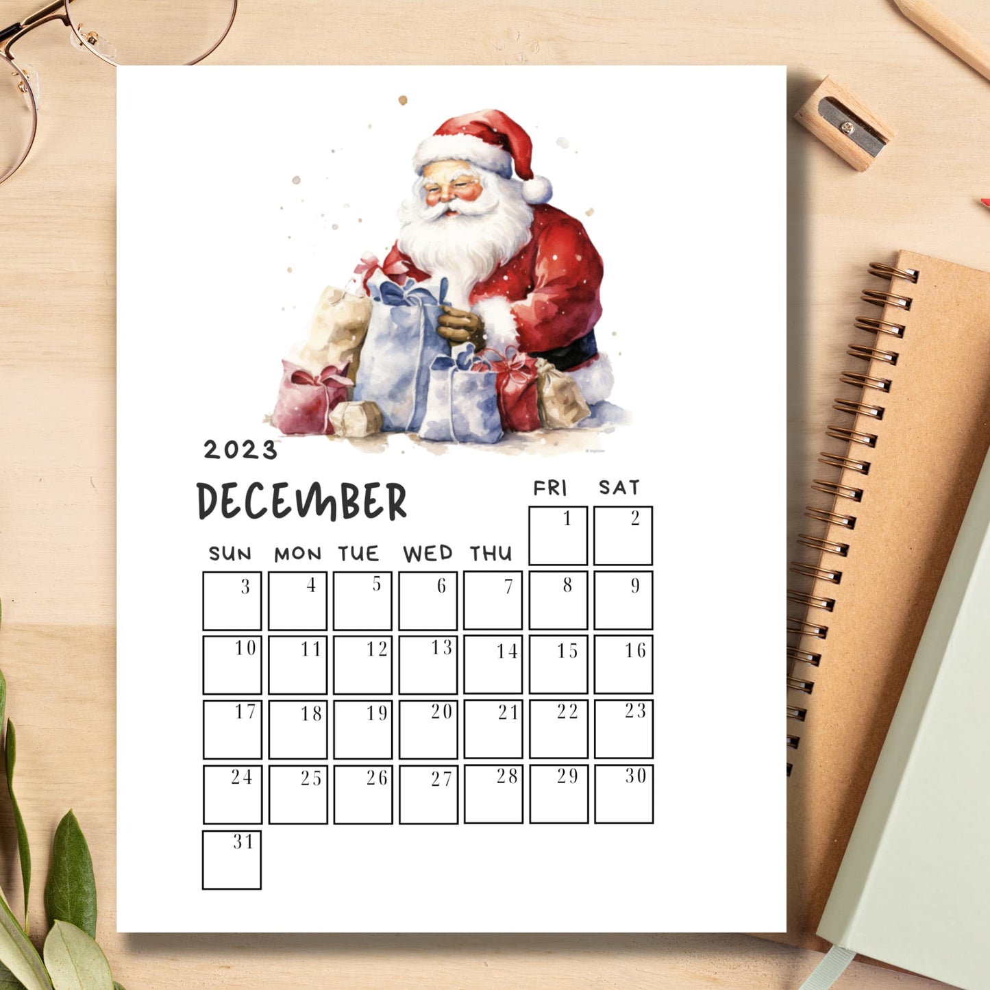 Sarsari Creations’ December 2023 calendar, laid out alongside notebooks, presenting a picture of efficient planning and organization, ideal for teachers and students planning their holiday season.