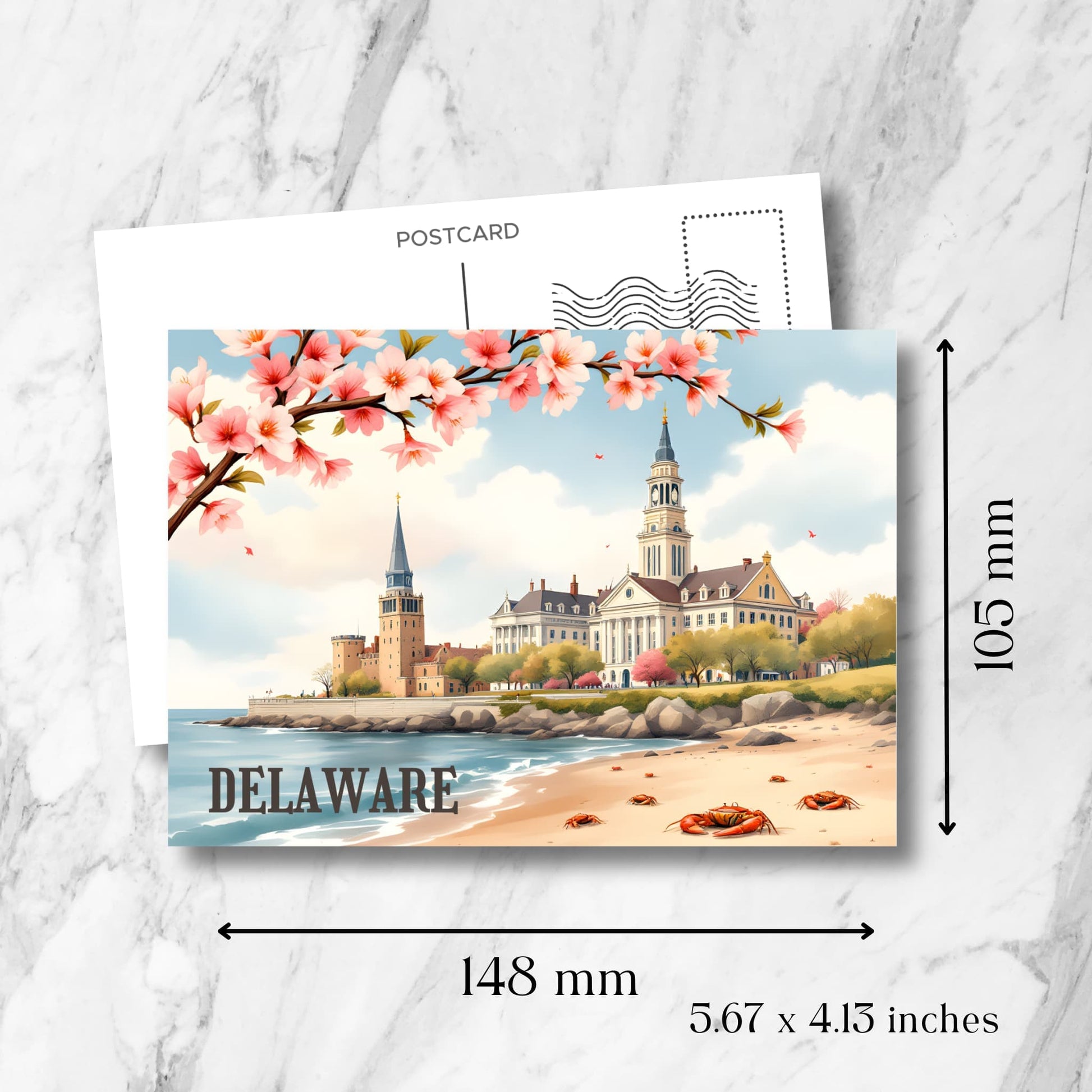 Delaware coastal postcard size demonstration (148x105mm) showing beach scene with historic buildings, pink cherry blossoms, and red crabs beneath vintage-style postmark template