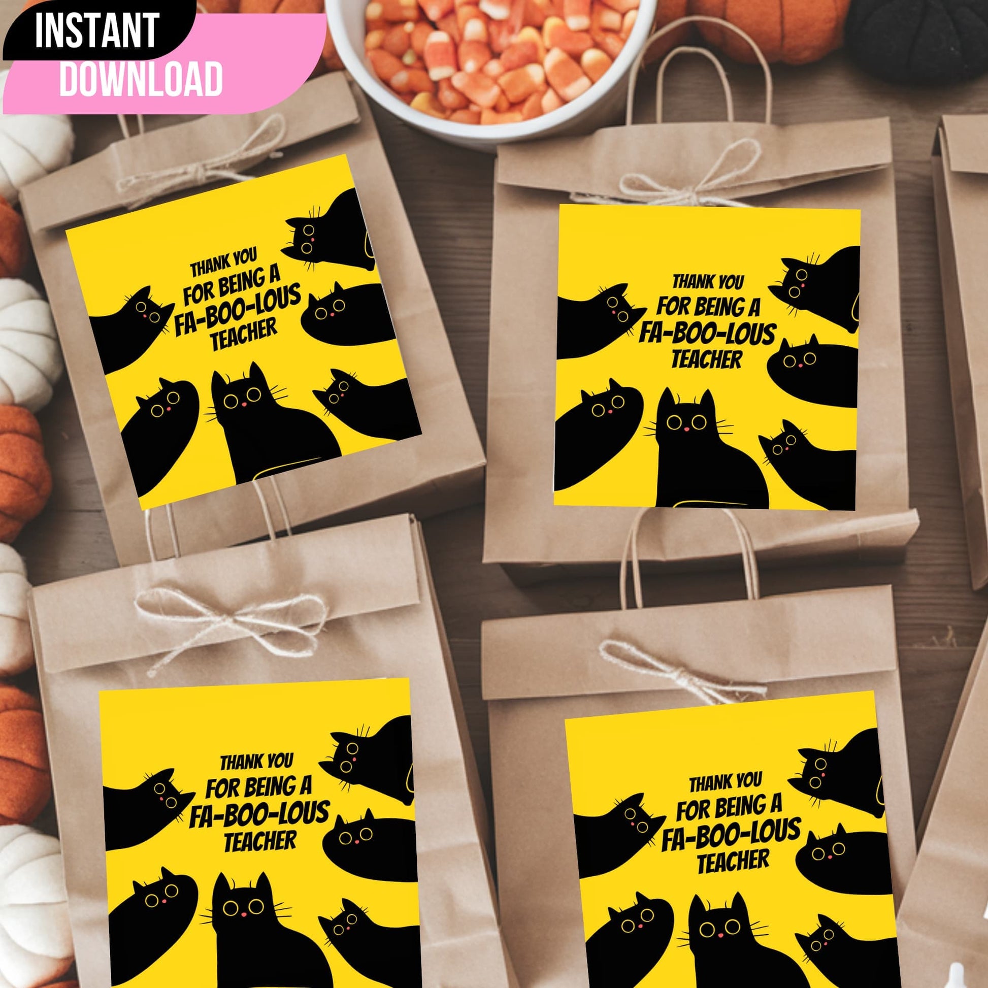 Halloween teacher appreciation tags with black cats on yellow background shown on kraft paper gift bags with twine bows, styled with candy corn and pumpkin decorations.