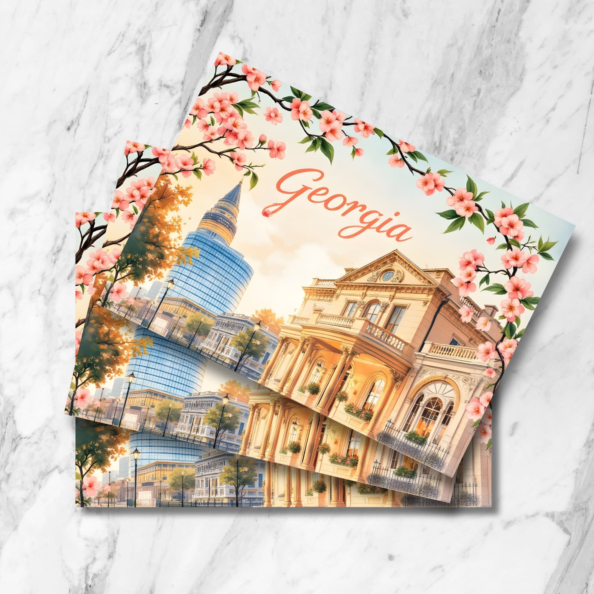 Stacked preview of Georgia cityscape postcards featuring glass skyscraper, Victorian mansion, spring cherry blossoms, and autumn trees in vintage watercolor style at sunset