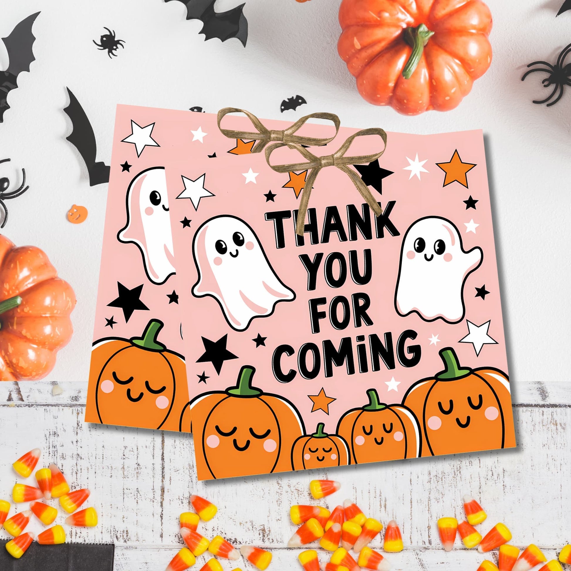 Halloween thank you tag with ghosts and pumpkins, surrounded by decorations and candy corn