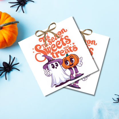 "It's the Season for Sweets and Treats" Halloween tags with cheerful ghost and pumpkin, arranged on light blue background with pumpkin decoration