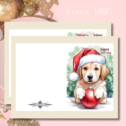 Free printable Christmas card featuring adorable Golden Retriever puppy in Santa hat with red ornament, 'Happy Howl-idays' text, decorative black divider on white background, 11x8.5 format