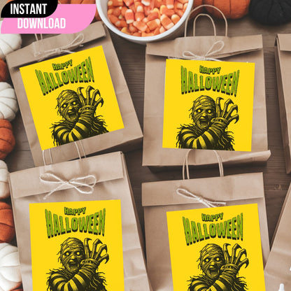 Vintage-style Halloween monster gift tags on kraft paper bags with twine bows, featuring dramatic mummy illustration on yellow background with green lettering, displayed with candy corn and pumpkins