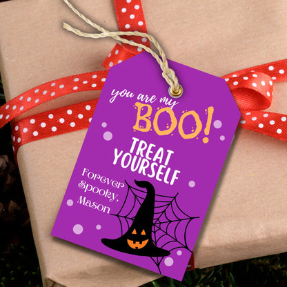 Halloween printable tag showcased on a brown gift box.