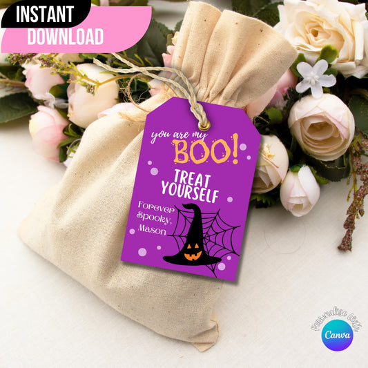  Halloween printable tag displayed on a gift bag with flowers on the side.
