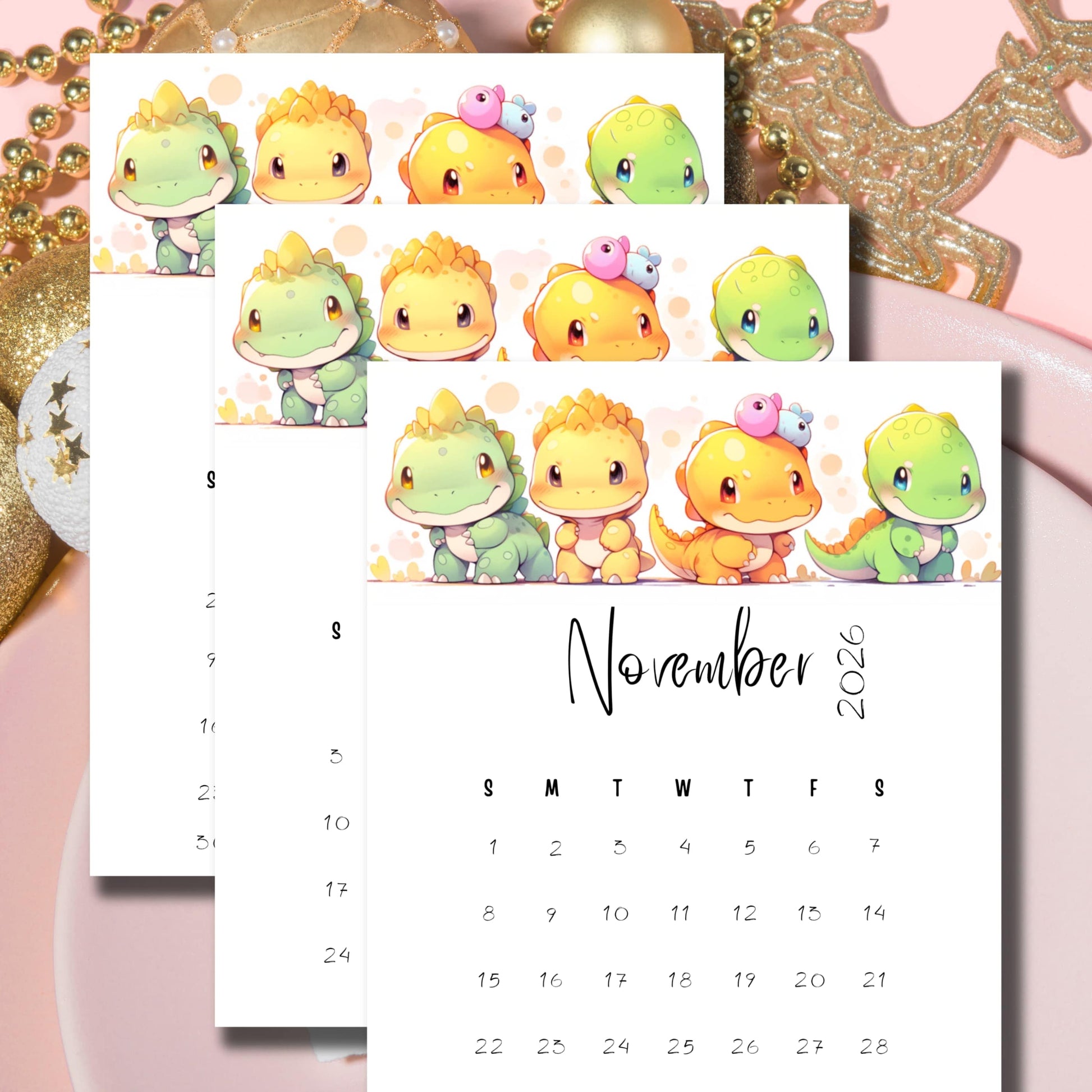 Stacked monthly calendars featuring chibi dinosaur friends and pastel accents, styled with golden holiday decorations on pink background