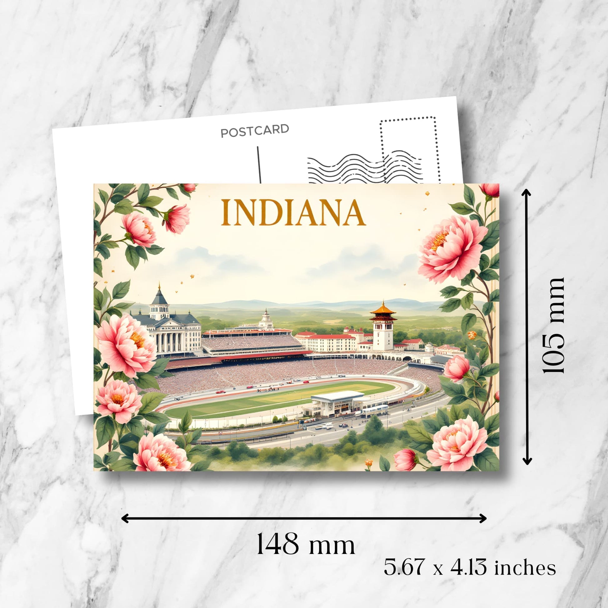 Indiana souvenir postcard with dimensions displayed: 148mm x 105mm (5.67 x 4.13 inches). Features Indy 500 racetrack, Indianapolis skyline, pink peonies frame, and standard postcard back layout.