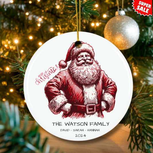 Custom ceramic ornament with red vintage Santa illustration displayed on lit Christmas tree, personalized with The Watson Family and three names, Super Sale tag.