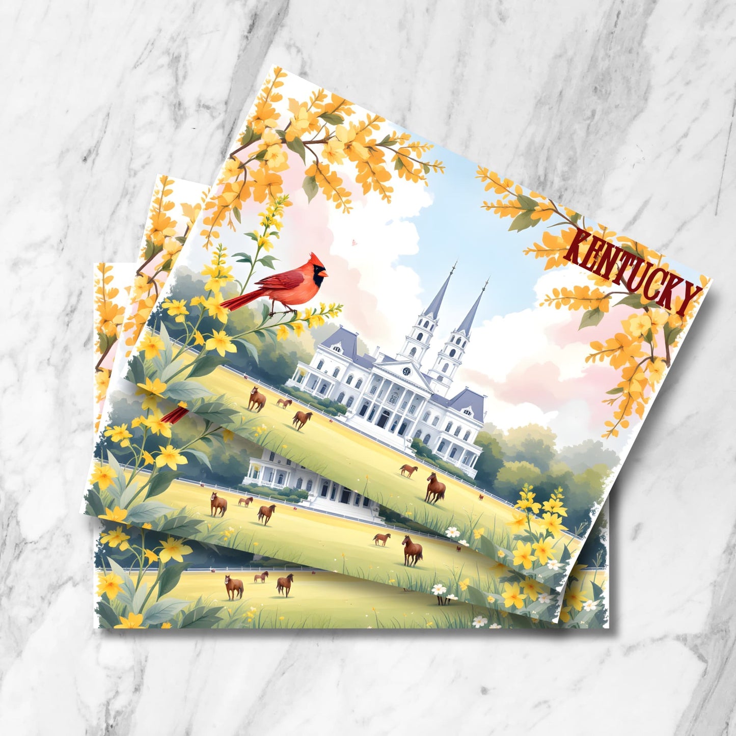 Stack of Kentucky postcards featuring white historic mansion with twin spires, grazing horses in meadow, cardinal bird, and golden forsythia blooms on marble background