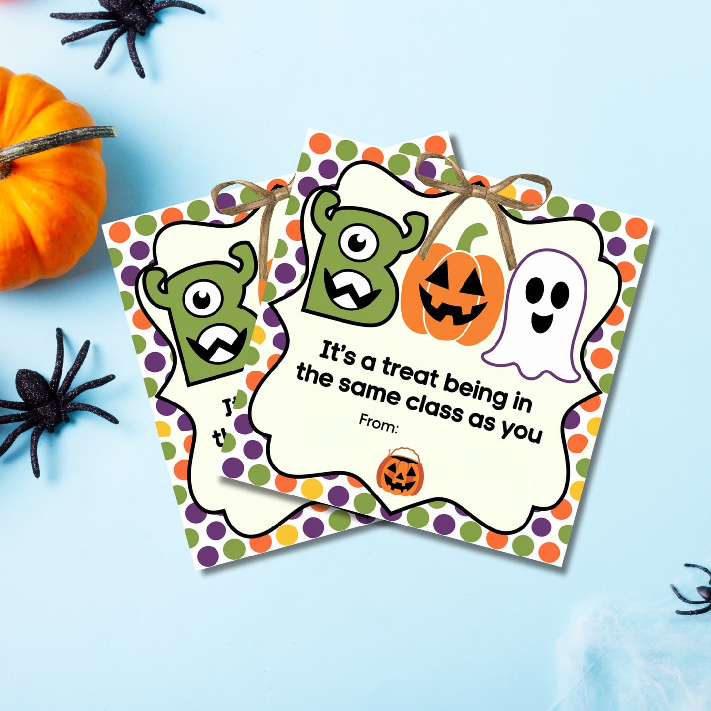 Green and orange Halloween Boo Bag stickers for kids displayed with pumpkin and spider decorations, perfect for teacher and coworker gifts