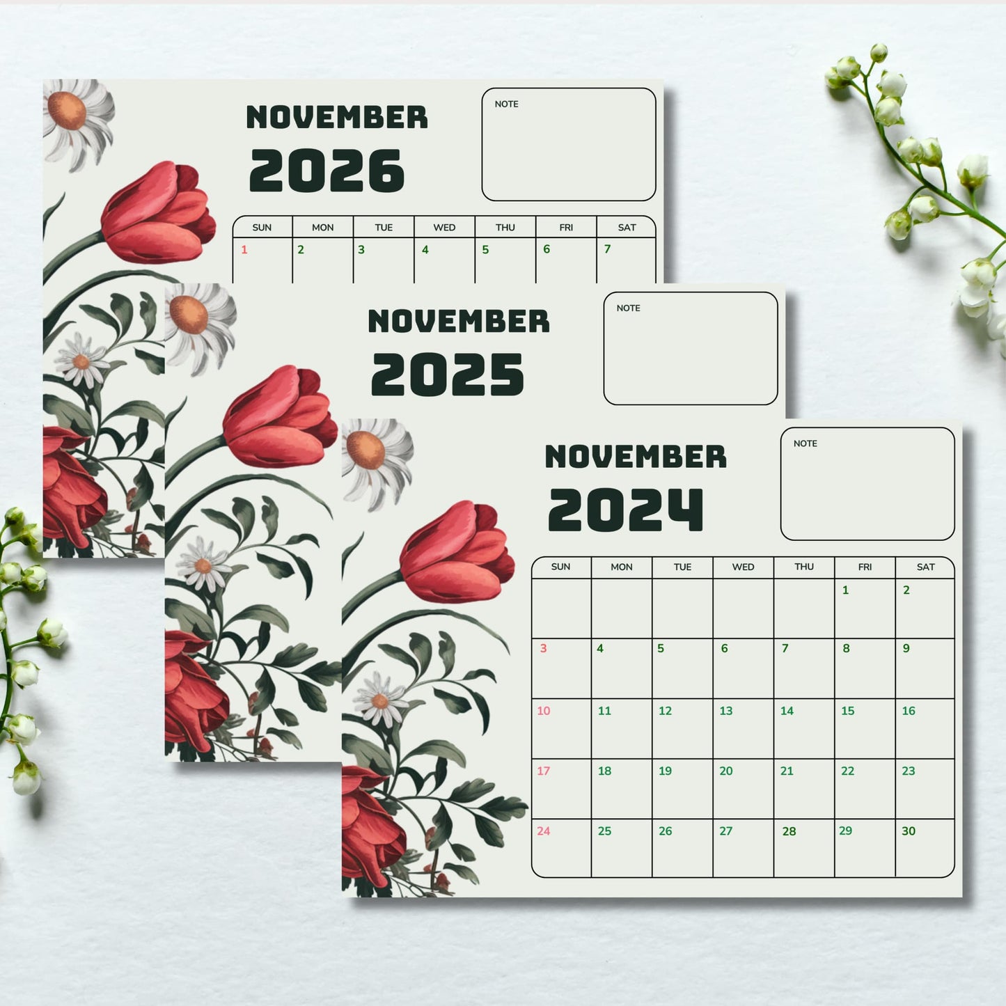 Flat lay of November calendar set 2024-2026 with watercolor tulips and daisies, styled with lily of the valley flowers on white background, includes notes section